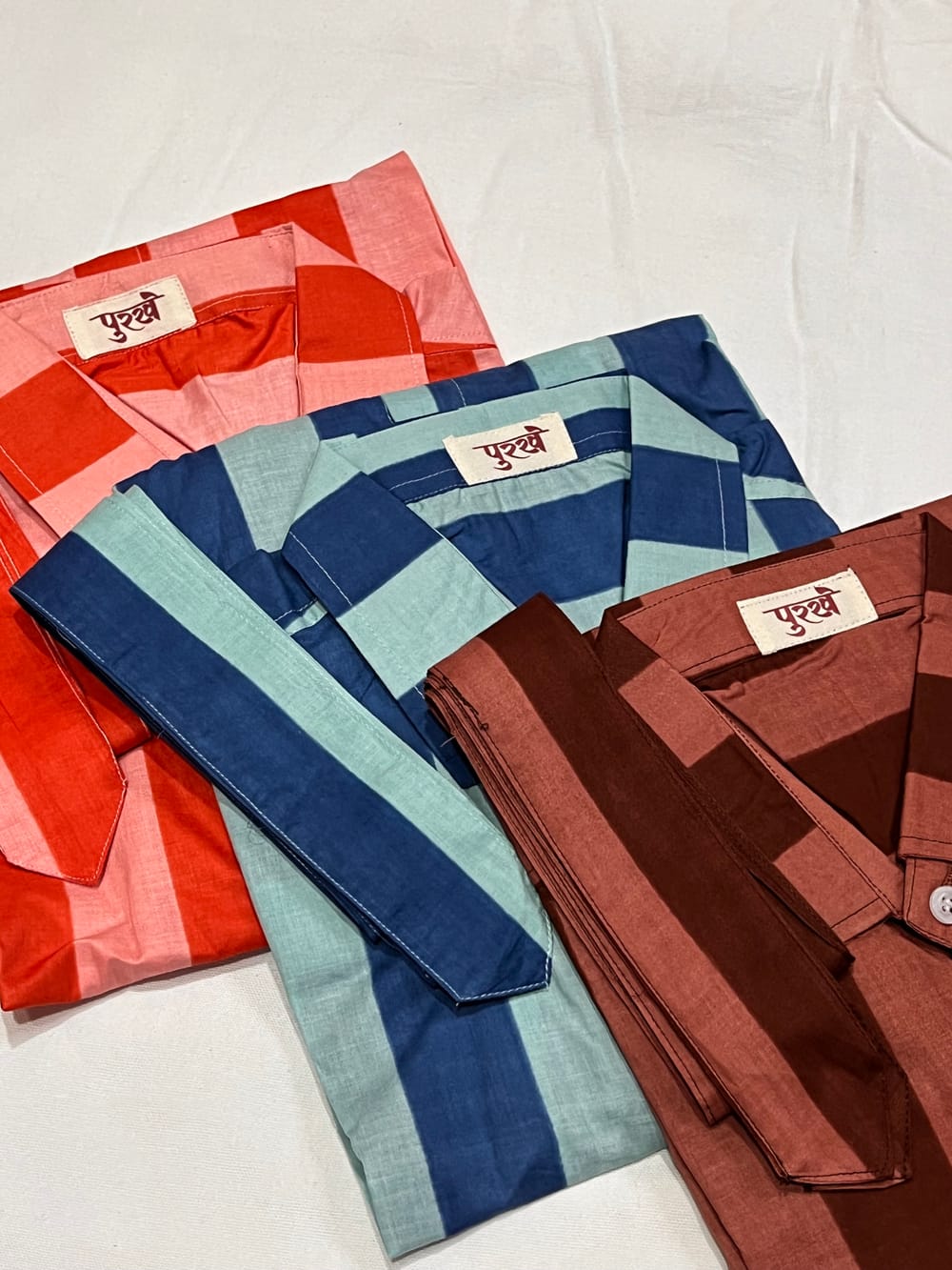 All three colourways folded together